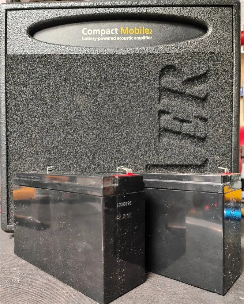 AER Compact Mobile Lead Acid Batteries in front of amplifier